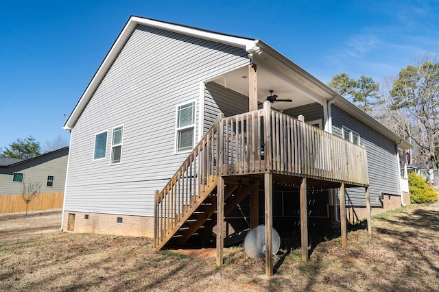 rear view of house featuring a ceiling fan, crawl space, a wooden deck, and stairs