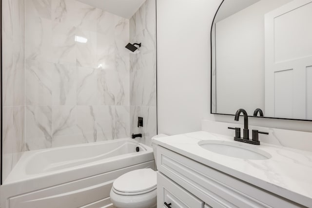 full bath featuring washtub / shower combination, vanity, and toilet