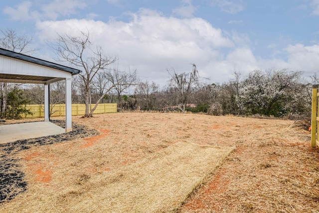 view of yard with fence and a patio