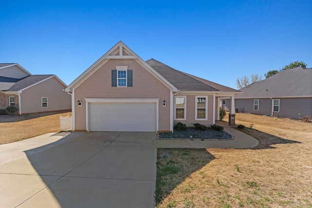 view of front of home with driveway and a front lawn