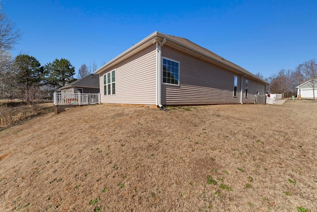 view of property exterior with a yard