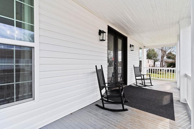 wooden terrace with a porch