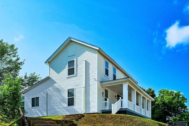 view of home's exterior featuring a porch