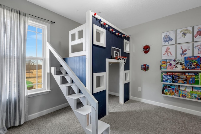 bedroom with carpet floors, multiple windows, and baseboards