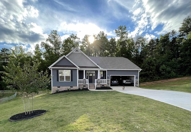 craftsman house with a garage, driveway, crawl space, and a front yard