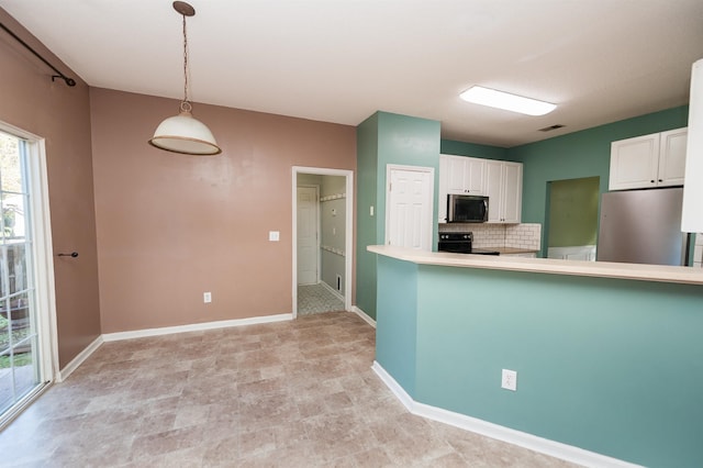 kitchen with white cabinets, visible vents, stainless steel appliances, tasteful backsplash, and hanging light fixtures