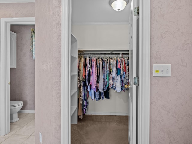 spacious closet with tile patterned floors