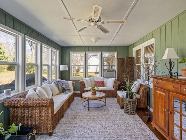 sunroom with ceiling fan and cooling unit