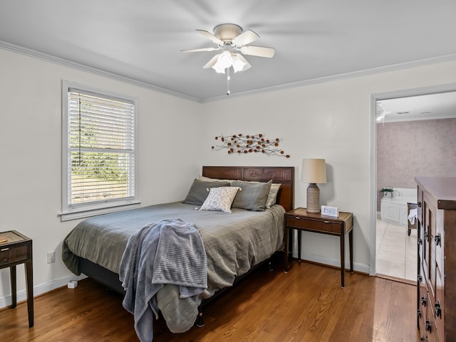 bedroom featuring ornamental molding, a ceiling fan, baseboards, and wood finished floors