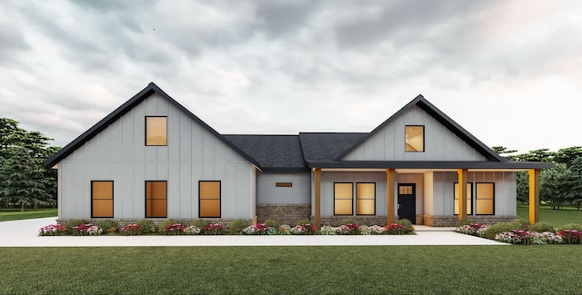 modern inspired farmhouse with a front lawn, board and batten siding, a shingled roof, and brick siding