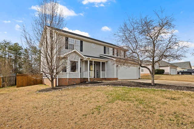 traditional home with concrete driveway, covered porch, fence, and a front lawn