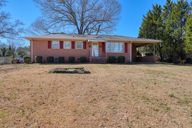 single story home with an attached carport, brick siding, and a front lawn