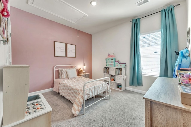 carpeted bedroom with visible vents, attic access, and baseboards