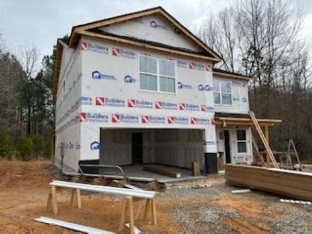 unfinished property with a garage