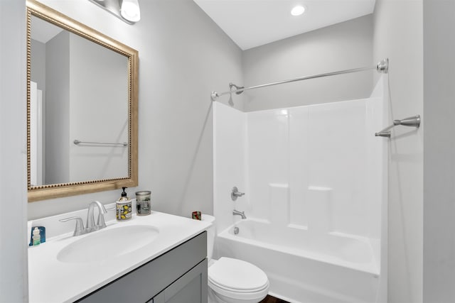 full bathroom featuring shower / bath combination, vanity, and toilet