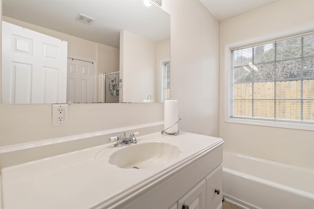 full bathroom with visible vents, an enclosed shower, vanity, and a bath