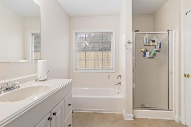 bathroom with a garden tub, plenty of natural light, a shower stall, and vanity