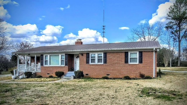 ranch-style home featuring crawl space, brick siding, metal roof, and a chimney