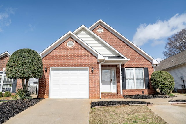 traditional home featuring a garage, concrete driveway, and brick siding