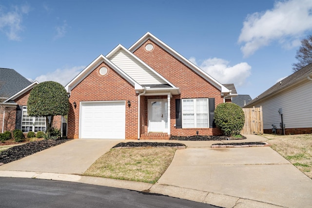 view of front of home featuring a garage, driveway, and brick siding