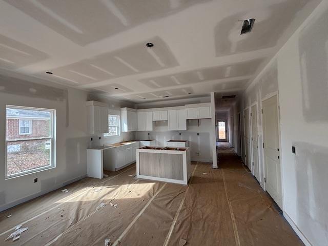 kitchen featuring white cabinets and a kitchen island