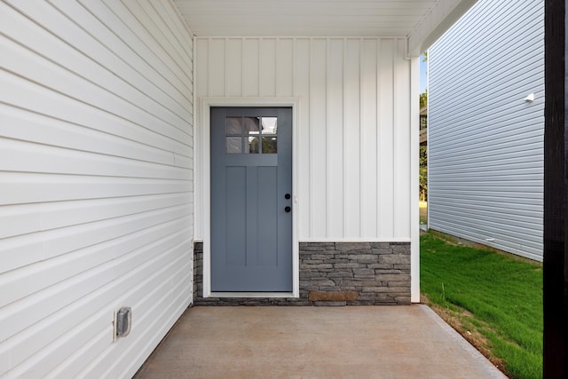 view of exterior entry with stone siding