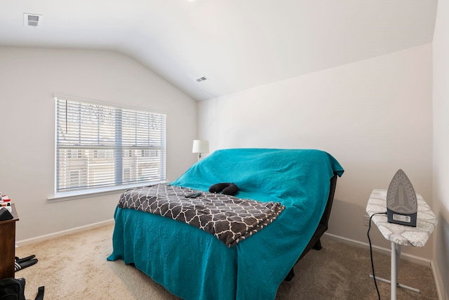 bedroom with vaulted ceiling, carpet flooring, baseboards, and visible vents