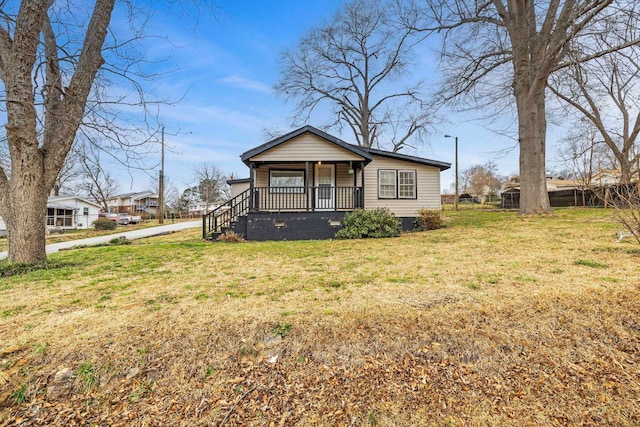 view of front of home with a porch and a front yard