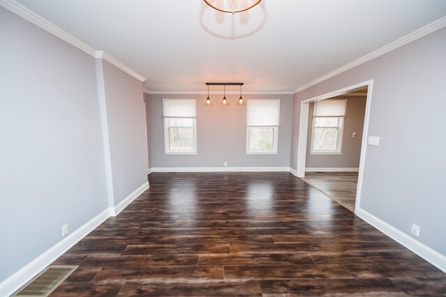 interior space with crown molding, dark wood-style floors, and baseboards