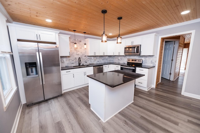 kitchen with ornamental molding, wood ceiling, appliances with stainless steel finishes, and a sink
