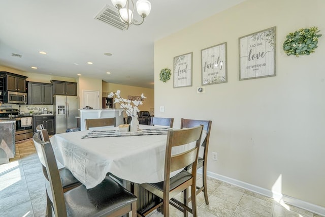 dining area featuring recessed lighting, baseboards, visible vents, and a chandelier