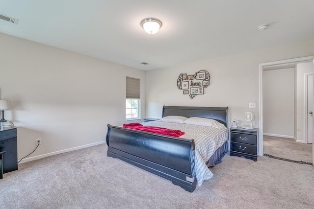 bedroom with visible vents, baseboards, and carpet flooring