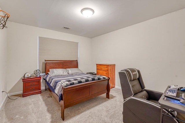 carpeted bedroom featuring visible vents and baseboards