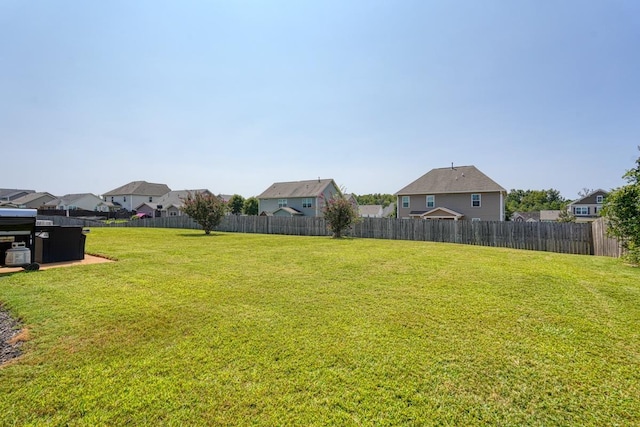 view of yard featuring a residential view and fence