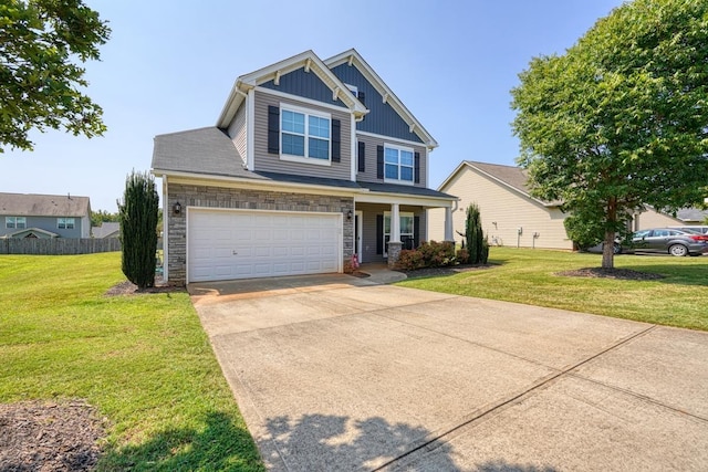 craftsman-style home featuring board and batten siding, a front lawn, driveway, stone siding, and an attached garage