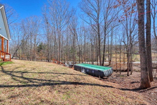 view of yard featuring a wooded view