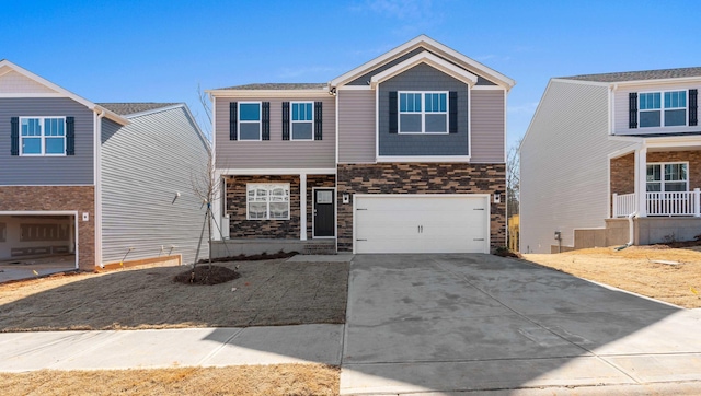 view of front of home with concrete driveway, a garage, and stone siding