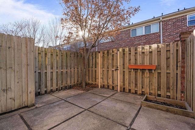 view of patio / terrace featuring fence