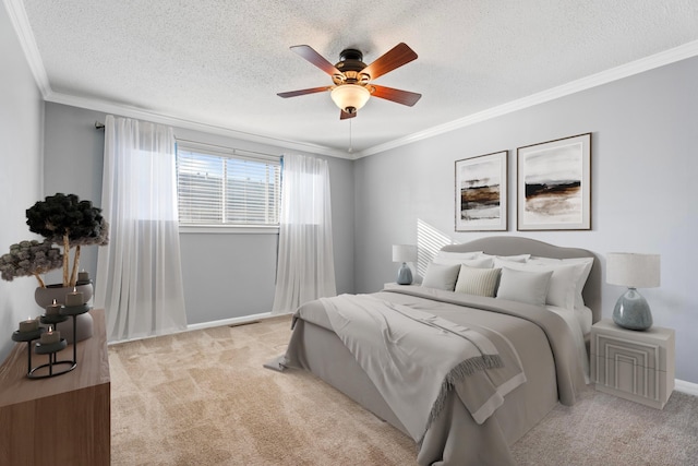 bedroom featuring ceiling fan, light carpet, a textured ceiling, and ornamental molding