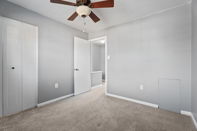 unfurnished bedroom featuring a closet, baseboards, and carpet floors