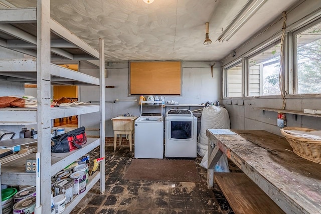 laundry area with a sink and washing machine and dryer