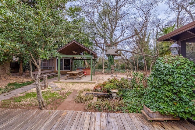 exterior space with a deck and a patio