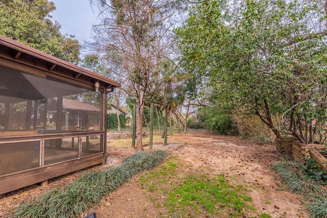 view of yard with a sunroom