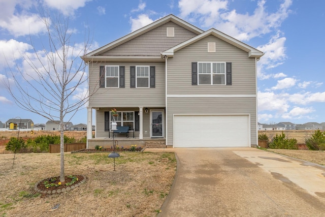 traditional-style house with concrete driveway, an attached garage, fence, and covered porch