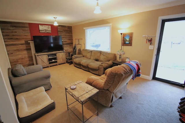 living room featuring light carpet, wooden walls, crown molding, and baseboards