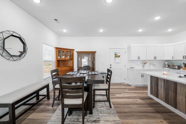 dining room featuring recessed lighting, wood finished floors, and visible vents