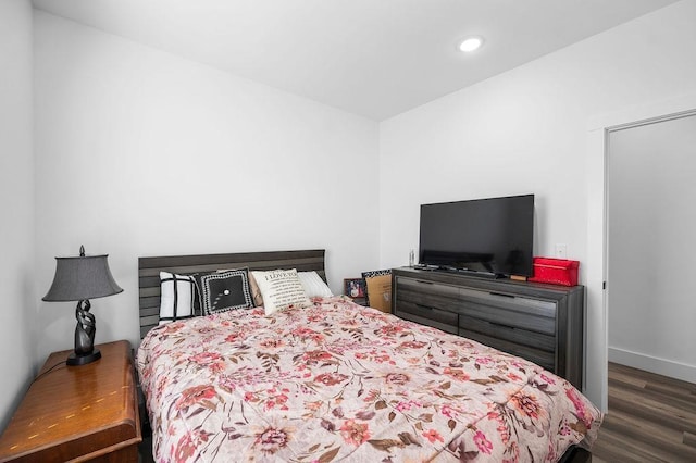 bedroom featuring recessed lighting, baseboards, and wood finished floors