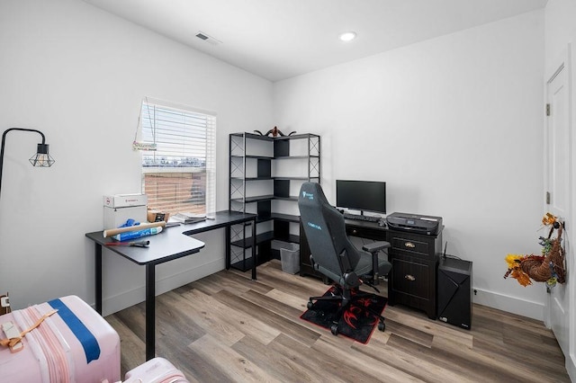 office featuring recessed lighting, wood finished floors, visible vents, and baseboards