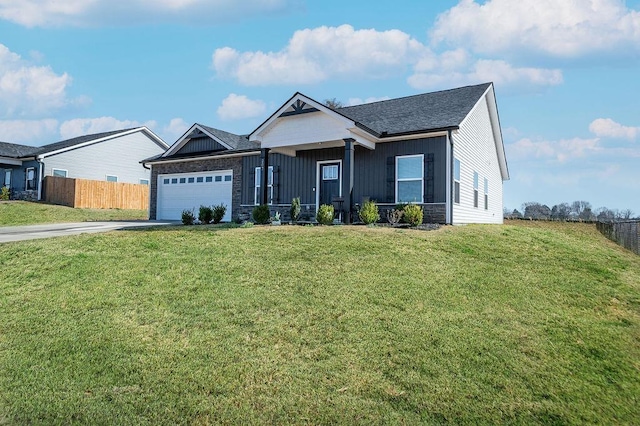 single story home featuring board and batten siding, a front lawn, fence, driveway, and an attached garage