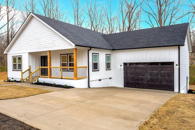 modern farmhouse with crawl space, covered porch, an attached garage, and roof with shingles